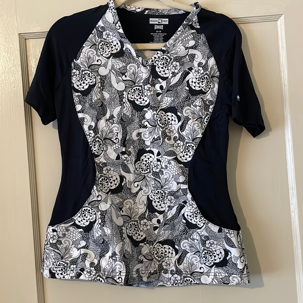 Scrub top. Never worn. Has stretch for comfort. Perfect for healthcare worker.